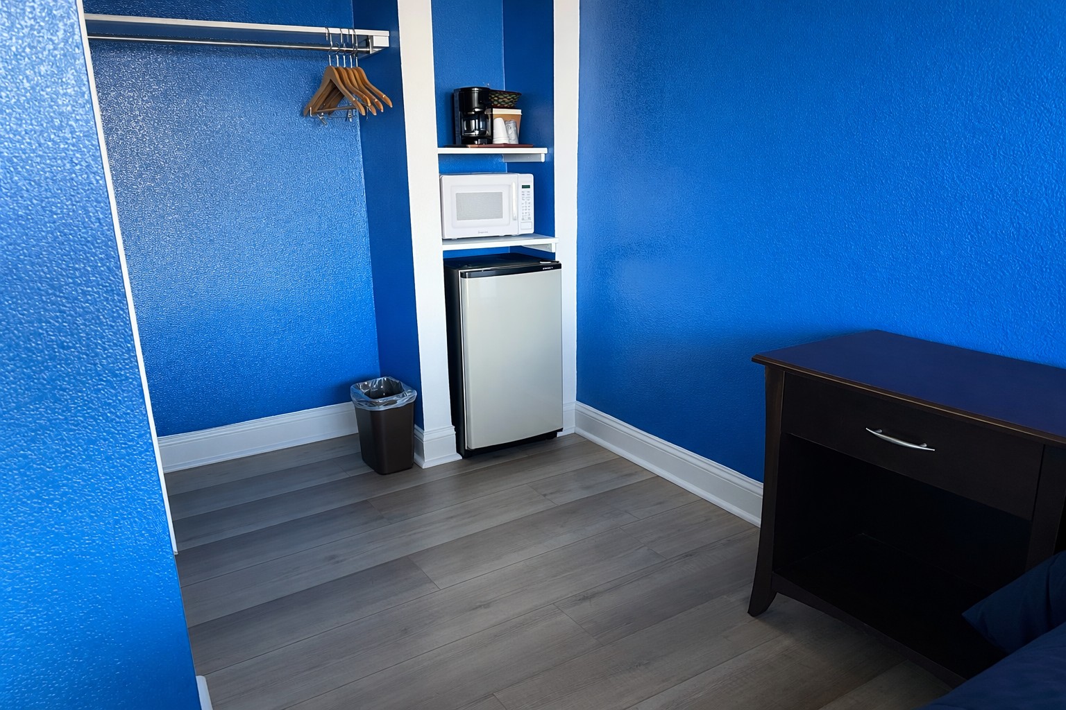 1 King Bed Room - Clean king room interior with with mini-fridge and microwave